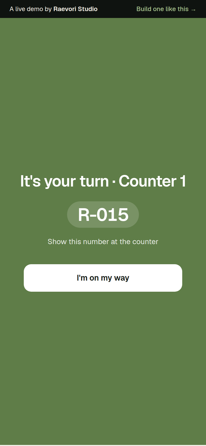 A full-screen green message on a phone: It’s your turn, counter 1, number R-015, with an I’m on my way button.